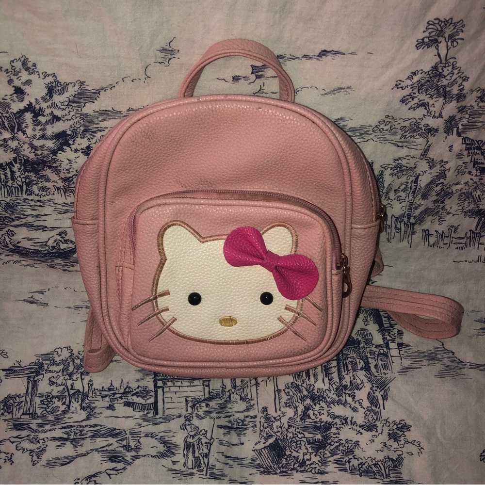 pink “leather” hello kitty backpack purse.